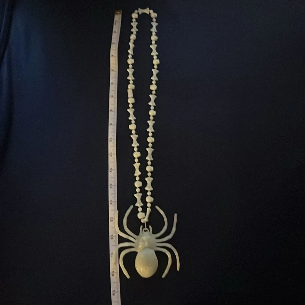 Halloween Spider and bones glow in the dark necklace.